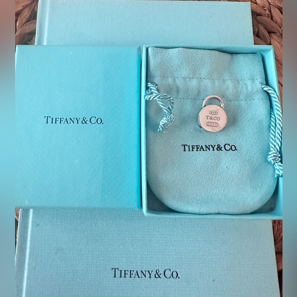 Tiffany & Co. Jewelry - Authentic Tiffany and Co silver round TCO lock charm